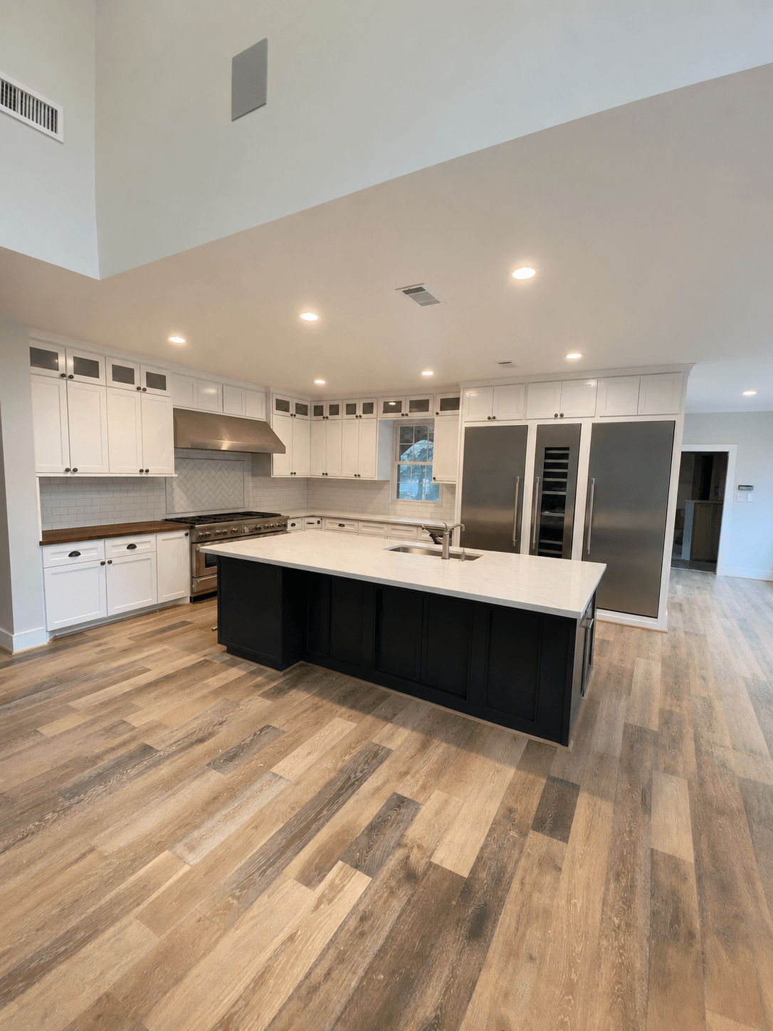 Renewed Shaker kitchen with custom refrigerator and wine cooler surround
