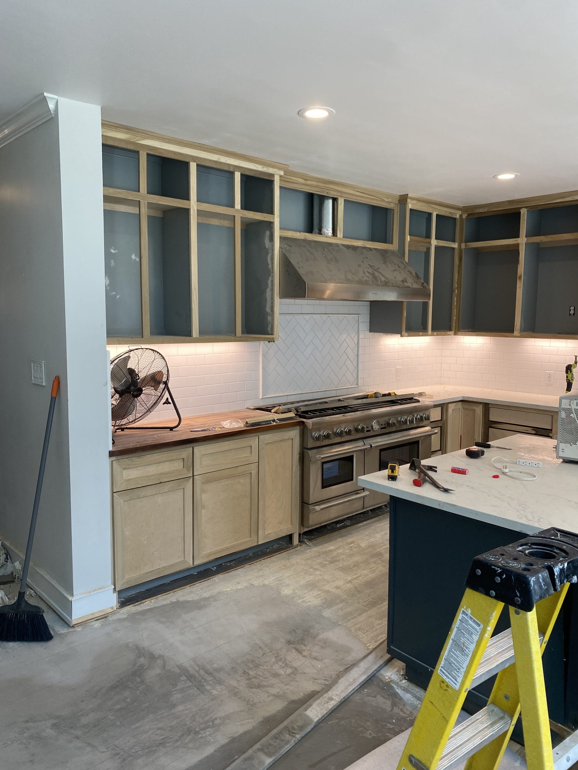 Existing solid cabinet face frames reworked for new Shaker fronts, full project view 3